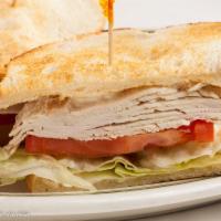 Fresh Turkey Breast Sandwich · Piled high on toasted sourdough.
