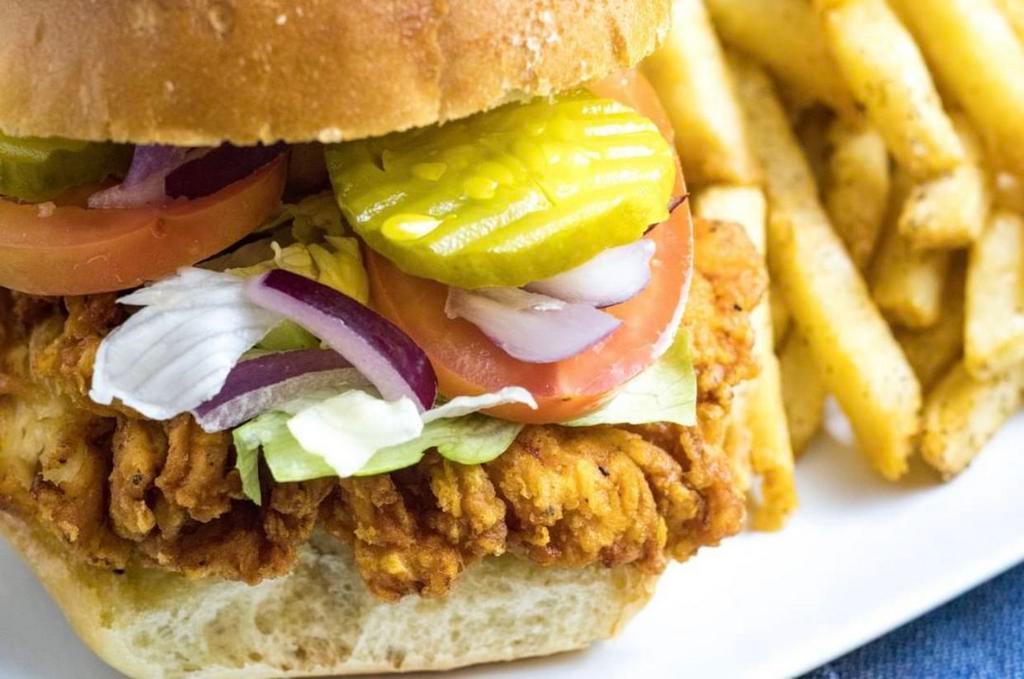 Crispy Chicken Breast Sandwich · Chicken breast, breaded in-house, fried to perfection in peanut oil, served on a Brioche bun, with ketchup, mayo, lettuce, onions, tomatoes and pickles.