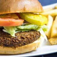 Falafel Burger · Falafel patty served on a brioche bun, with ketchup, mayo, lettuce, onions, tomatoes and pic...