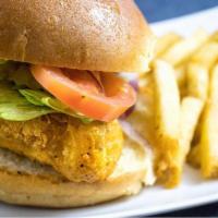 Fried Cod Sandwich · Wild cod, breaded in house, fried in peanut oil and served with onions, tomato, lettuce, pic...