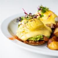 Eggs Benedict · poached eggs, avocado smash, english muffin, hollandaise, country potatoes