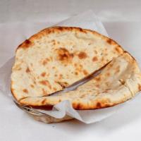 2. Naan · Leavened bread baked in flaming charcoal clay oven made with enriched white flour.