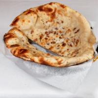 4. Onion Kulcha · Enriched white flour bread stuffed with chopped onions and fresh coriander.