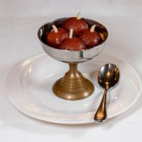 4. Gulab Jamun · Made of dry milk and soaked in syrup. Served warm.