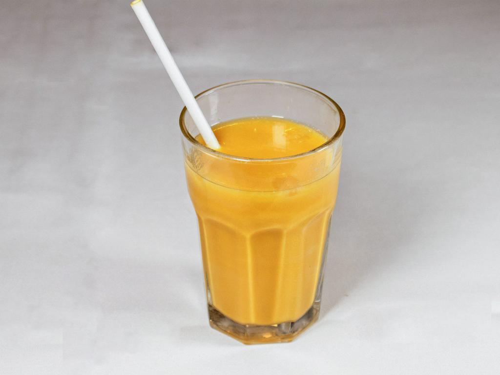 5. Mango Lassi · Refreshing yogurt - based mango smoothie, garnished with pistachio and cardamom.