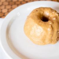 Praline Cake Doughnut  · Over Sized Cake Doughnut covered in Praline Sauce Cooked to Perfection. Melts in Your Mouth....