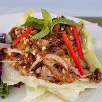 Duck Salad · Crispy duck with pineapple, red onion, ginger, crushed peanut, and lime juice.