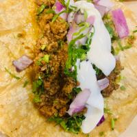 Ground Beef Taco · Cilantro, onion, and lime.