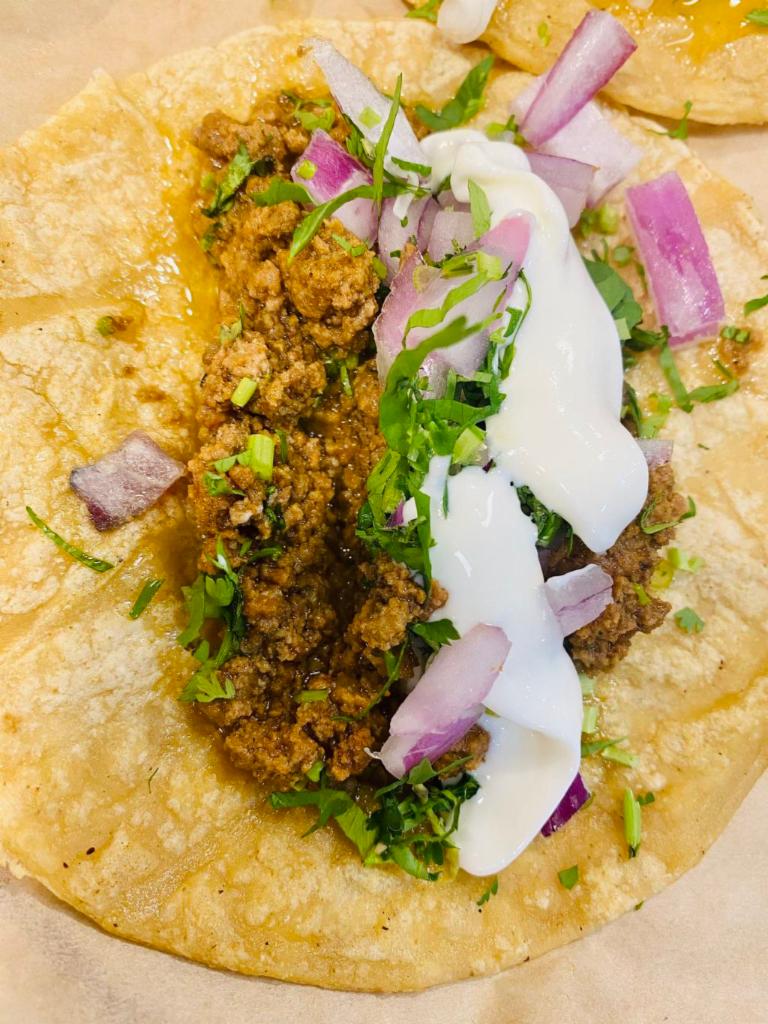 Ground Beef Taco · Cilantro, onion, and lime.