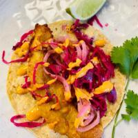 Fried Fish Taco · Fried fish, chipotle, mayo, marinated onion, cabbage and lime.