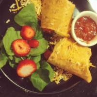 Breakfast Burrito · 2 steamed eggs, sausage and cheese wrapped in a tomato basil tortilla. Served with a side of...