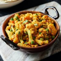 Aloo Gobi · Cauliflower florets & potatoes sauteed with grilled onion, turmeric, ginger and cumin in mil...