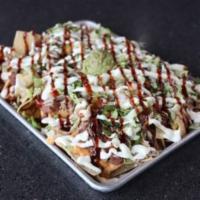 Tex Mex Nachos · Traditional nachos topped with seasoned ground beef, refried beans, chile con queso, jalapen...