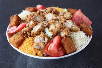 Fried Chicken Salad · Crispy fried chicken tenders, lettuce, tomatoes, cheese and jalapeno croutons.