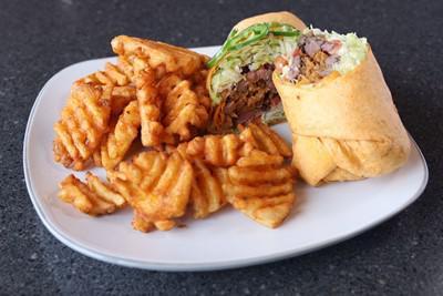 Steak Wrap · Mesquite-grilled sirloin with lettuce, tomato, cheese, onion straws and chipotle ranch sauce wrapped in a soft chipotle tortilla.  Served with your choice of side.
