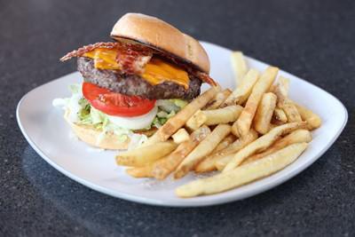 Smoked Cheddar Bacon Burger · Angus beef topped with bacon and smoked cheddar cheese. Served with lettuce, tomato, onion and pickles.  