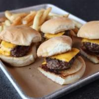 Angus Sliders · 4 juicy Angus beef mini-burgers. Served with cheese and pickle and bourbon glaze on the side.