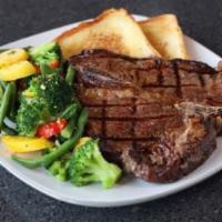 Porterhouse · A 20 oz. USDA choice bone in steak.  Served with your choice of two sides. 