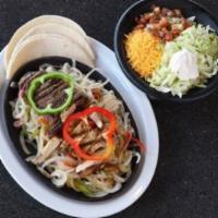Mesquite-Grilled Sirloin Fajitas · All fajitas are served with lettuce, pico de gallo, sour cream, guacamole, refried beans, ri...
