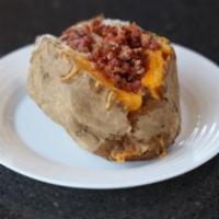 Loaded Baked Potato · Topped butter, sour cream, cheese and bacon.