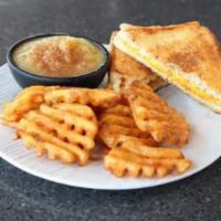 Kid's Grilled Cheese · Grilled Cheese served with applesauce topped with cinnamon sugar and your choice of side.