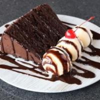 Mile High Chocolate Cake · Indulge yourself with a slice of our rich and delicious 5 layer chocolate cake.  Served with...