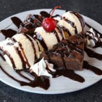 Double Barrel Brownie · Chocolate chip brownies served with vanilla ice cream.