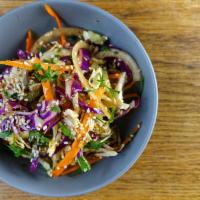 Spicy cabbage salad (V) · carrot 
red onion 
herbs 
sesame 
chili 