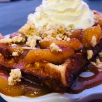 Caramel Apple Pie Waffle · Waffle topped with apple pie filling. Crunchy almod granola topping. Caramel, and whipped cr...