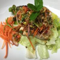 Plah Salmon · Grilled filleted salmon salad with mints, lemongrass and herbs in red chili paste. (Medium s...