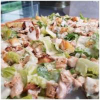Chicken Caesar Salad Pizza · Romaine lettuce, grilled chicken, croutons, and Caesar dressing.