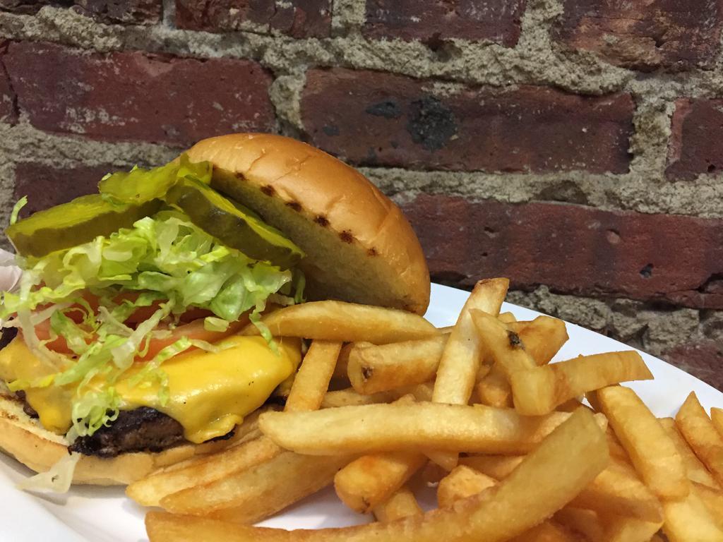 American Classic Cheeseburger · Pat LaFrieda beef patty with our signature burger sauce,  American cheese, tomato, onion, pickle, and shredded lettuce