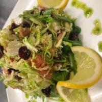 THE FANTASTIC BRUSSELS SPROUTS SALAD · Brussel Sprouts, arugula, Parmigiano Reggiano, cranberries, pear, walnuts, grapefruits and s...