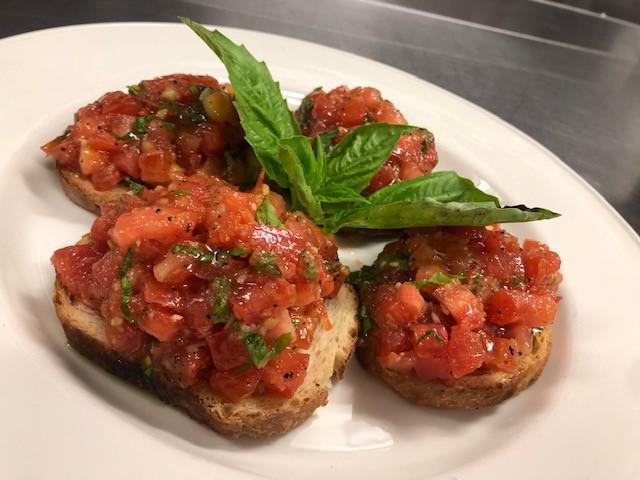 Bruschetta · Toasted bread (4 pieces) topped with chopped tomatoes, fresh basil, extra virgin olive oil and a touch of garlic.