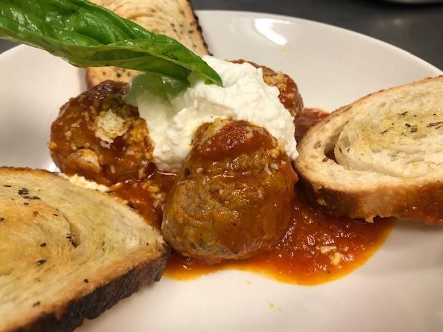 ITALIAN MEATBALLS · 100% home made beef meatballs (3pieces) served with tomato sauce, ricotta cheese and toasted bread)

