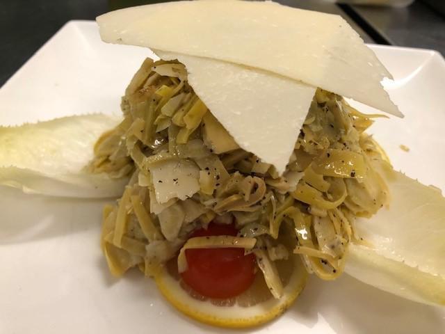Carciofi E Parmigiano Salad · Raw sliced artichoke hearts with Parmigiano Reggiano, lemon and extra virgin olive oil.