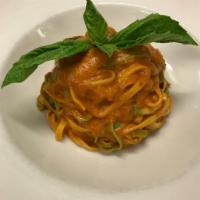 Paglia and Fieno · Homemade fettuccine, light tomato sauce, basil and Parmigiano Reggiano.