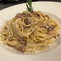 Spaghetti Carbonara · Italian pancetta, Parmesan and pecorino, eggs and crushed black pepper.