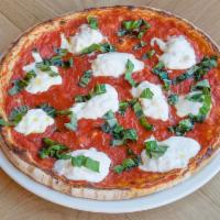 Alla Burrata Pizza · Imported Italian burrata, San Marzano tomato and basil. Vittorio's favorite pizza.