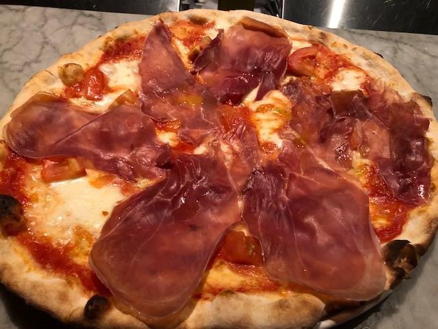 Di Fabio Pizza · Tomato, mozzarella, prosciutto di Parma and diced tomatoes.