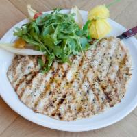 Chicken Breast Paillard · Natural free-range grilled chicken breast served with arugula and tomatoes.