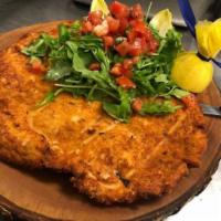 CHICKEN MILANESE · Breaded Free range chicken, served with arugula, diced tomatoes & basil