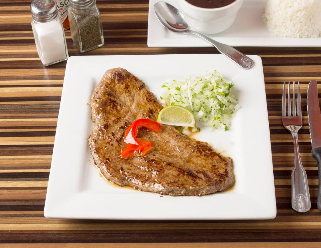 15. Bistec de Palomilla · Cuban style beef steak. Served with 2 sides.