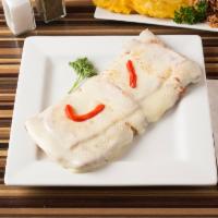 32. Milanesa de Pollo · Breaded chicken steak with cheese and ham. Served with 2 sides.