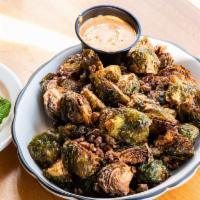 Fried Brussels Sprouts Appetizer · with spiced pecan pieces and chipotle aioli