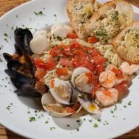 Zuppa di Pescatore · Mussels, clams, shrimp, and scallops in garlic, and white wine sauce.