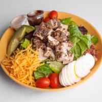 Jerk Chicken Cobb Salad · Mixed lettuce, hardboiled egg, tomato, bacon, avocado, and Cheddar cheese with ranch dressin...