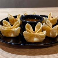 A4. Crab Cheese Wontons · Cream cheese, imitation crab, chopped green onions. Served with sweet & sour sauce.