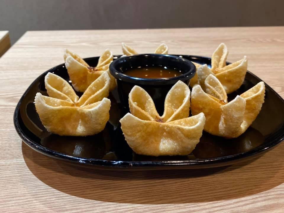 A4. Crab Cheese Wontons · Cream cheese, imitation crab, chopped green onions. Served with sweet & sour sauce.