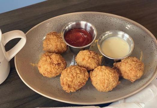 Hash Holes  · 5 hashbrown croquettes made with cheddar smoked Gouda and bacon. Served with Southwest ranch and queso. 